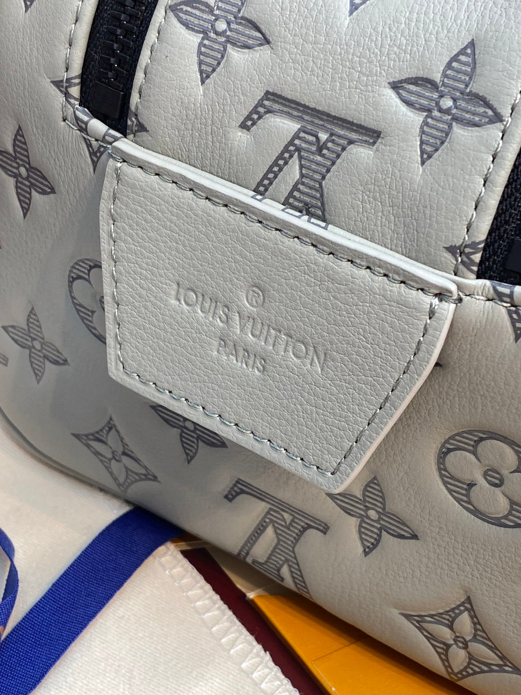 Louis Vuitton monogram toiletry bag front label pocket with stitched edges
