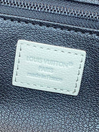 Louis Vuitton monogram toiletry bag leather label with stitched text