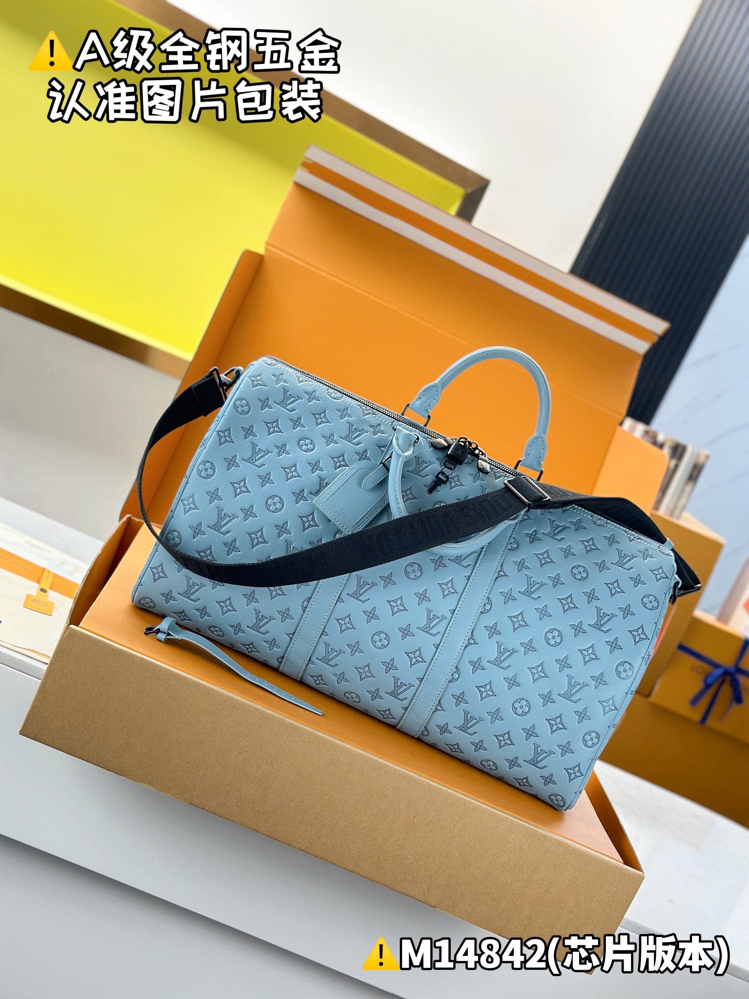 Light-blue Louis Vuitton monogram duffel bag with light-blue handles and zipper