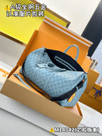 Light-blue Louis Vuitton monogram duffel bag with black rear pocket panel