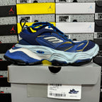 Balenciaga lace-up sneakers on box, blue upper with gold trim and white midsole