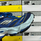 Balenciaga sneakers side profile, blue upper with gold lines on white midsole