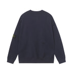 Crewneck knit sweater in dark navy, back view, ribbed hem and long sleeves.