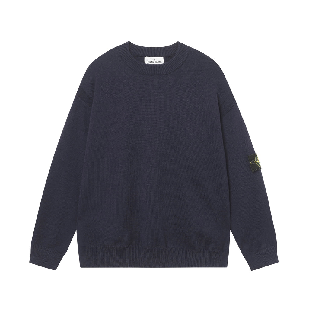 Crewneck knit sweater in dark navy with long sleeves and ribbed hem and cuffs.