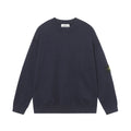 Crewneck knit sweater in dark navy with long sleeves and ribbed hem and cuffs.