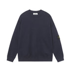 Crewneck knit sweater in dark navy with long sleeves and ribbed hem and cuffs.