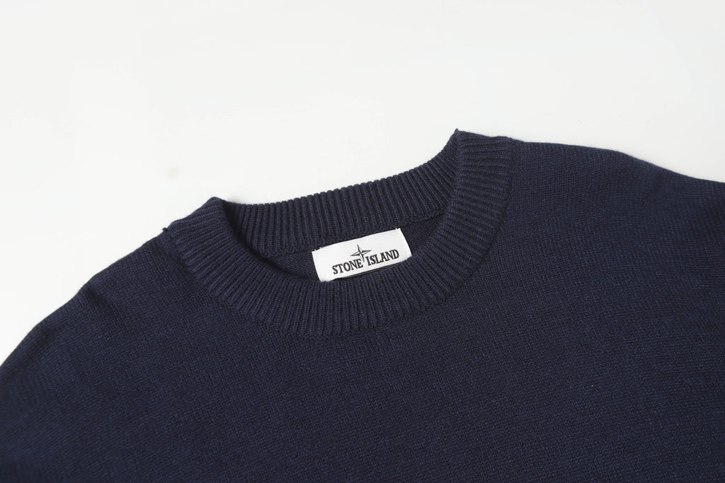 Crewneck knit sweater neckline with Stone Island logo patch on the collar.
