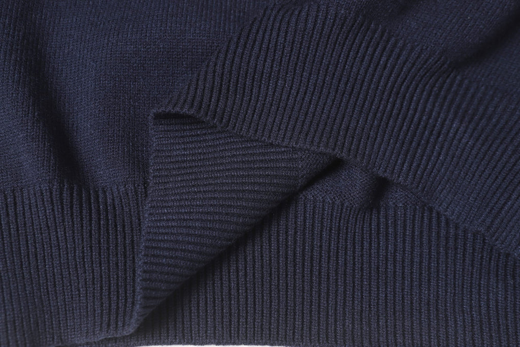 Dark navy knit sweater knit texture with ribbed shoulder and sleeve seam.
