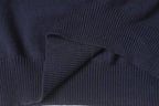 Dark navy knit sweater knit texture with ribbed shoulder and sleeve seam.