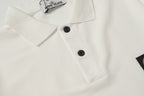 White polo shirt front with two black buttons and raised collar