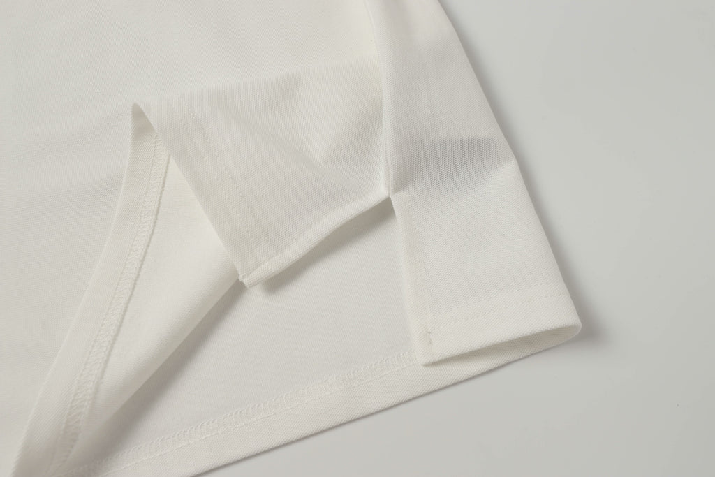 White polo shirt cuff and sleeve seam close-up