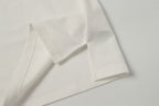 White polo shirt cuff and sleeve seam close-up