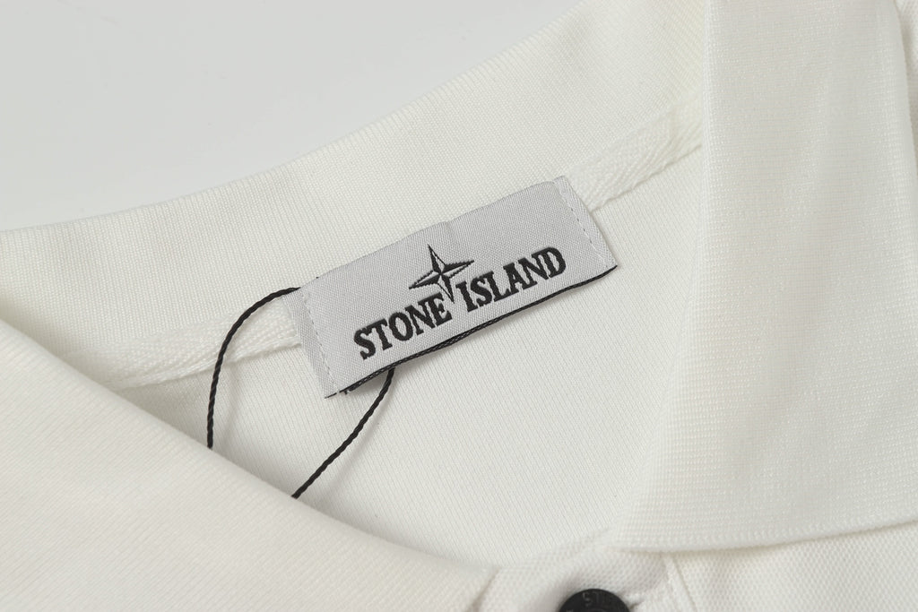Stone Island label on white polo shirt neckline with dark button
