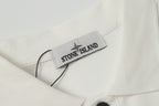Stone Island label on white polo shirt neckline with dark button