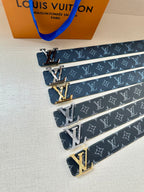 Louis Vuitton monogram belt set showing dark blue straps and gold-toned LV buckles