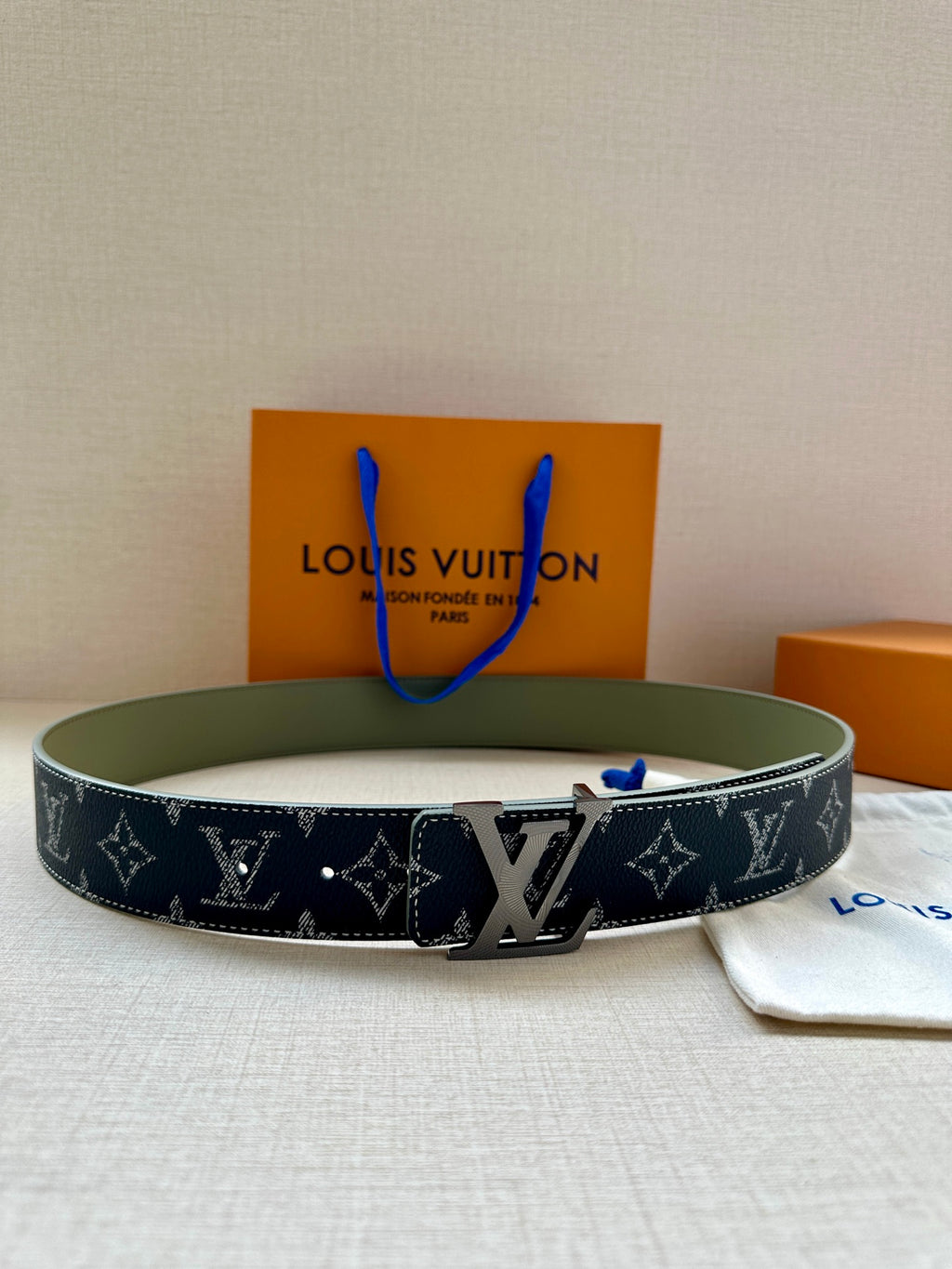 Navy Louis Vuitton monogram belt with silver-tone buckle and keeper strap
