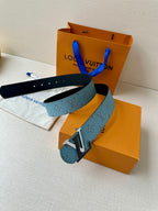 Louis Vuitton blue monogram belt with silver buckle, shown alongside black strap
