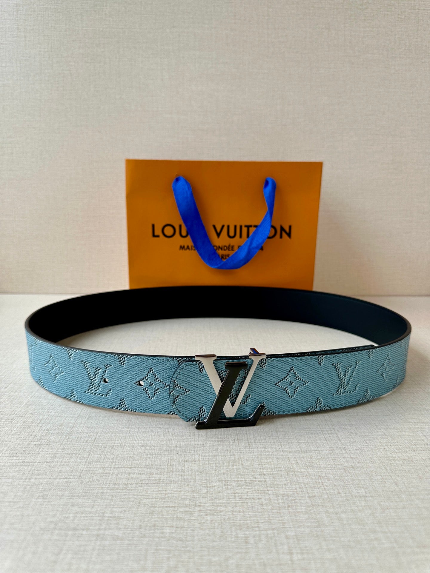 Louis Vuitton belt in blue monogram canvas with silver-tone buckle, flat