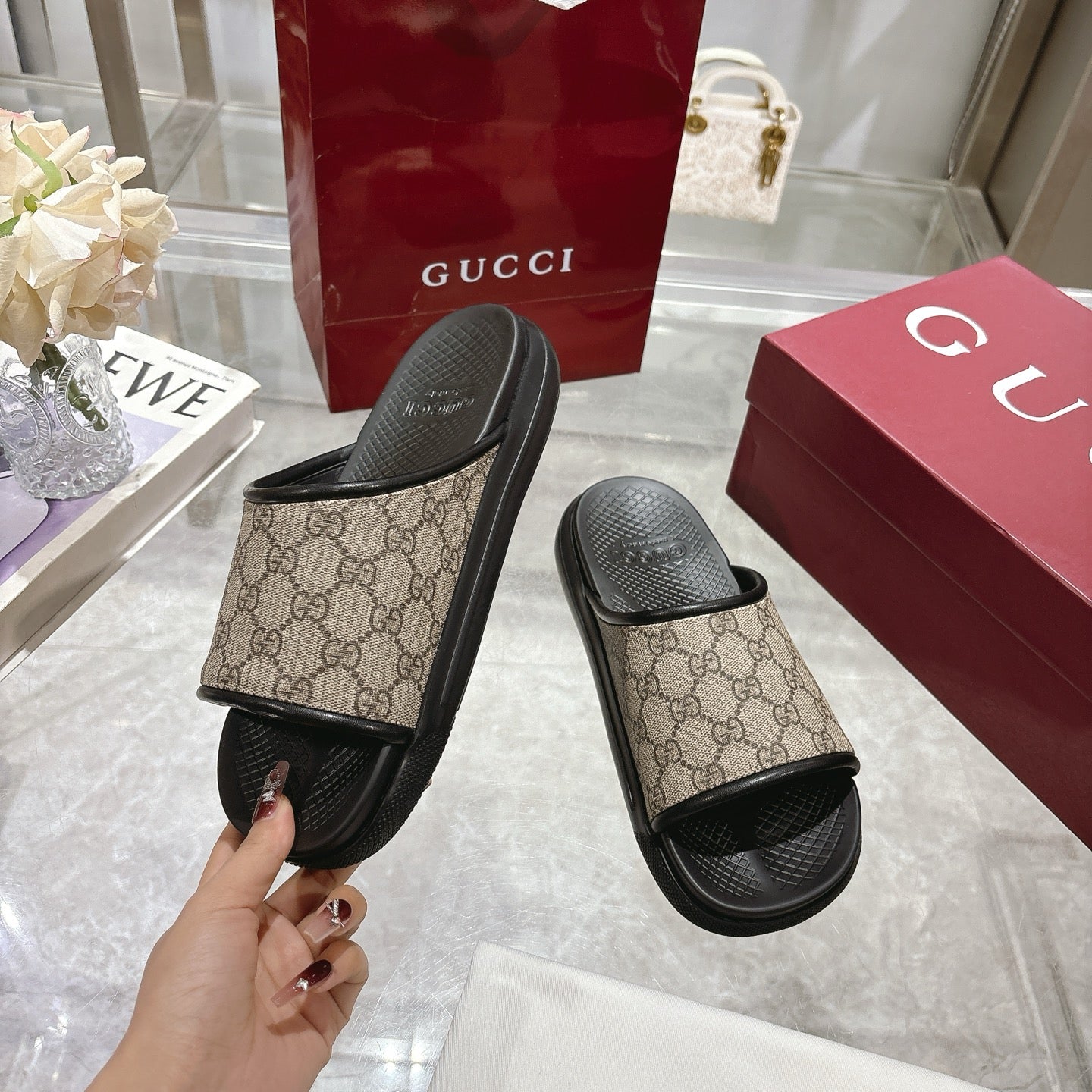 Gucci slide sandals, tan GG-pattern upper with black rubber straps and textured footbed