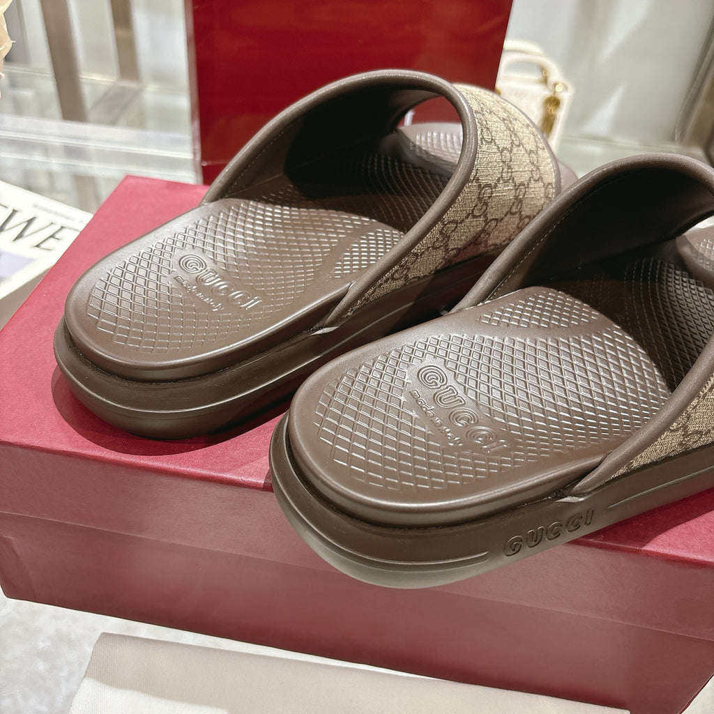Gucci slide sandals close-up of footbeds with GG canvas straps