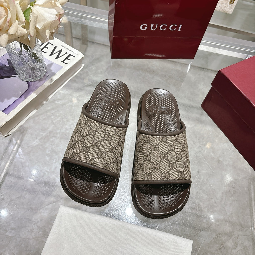 Gucci GG monogram slide sandals with dark molded footbeds
