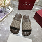 Gucci GG monogram slide sandals with dark molded footbeds