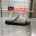 Gucci slide sandals with GG monogram canvas upper and black rubber sole