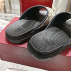Close-up of Gucci GG slide sandals footbeds with textured black tread