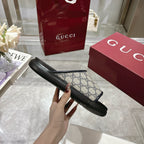 Gucci GG slide sandals shown from the side, with black platform sole and strap