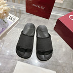 Gucci black logo slide sandals, two straps over cushioned footbeds