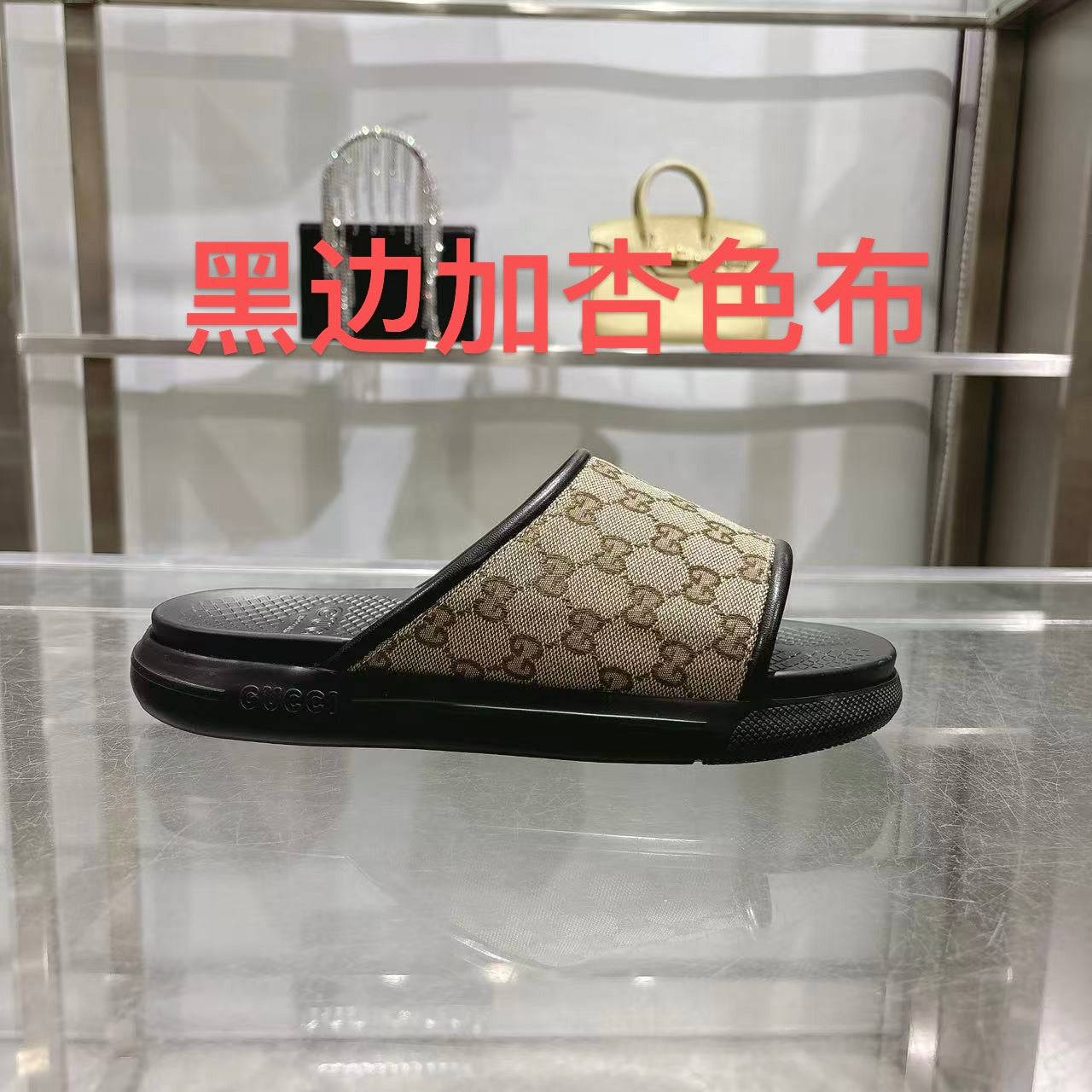 Gucci slide sandals with beige GG canvas strap and black rubber sole, open toe
