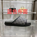Gucci slide sandals with GG monogram strap, black rubber sole and footbed