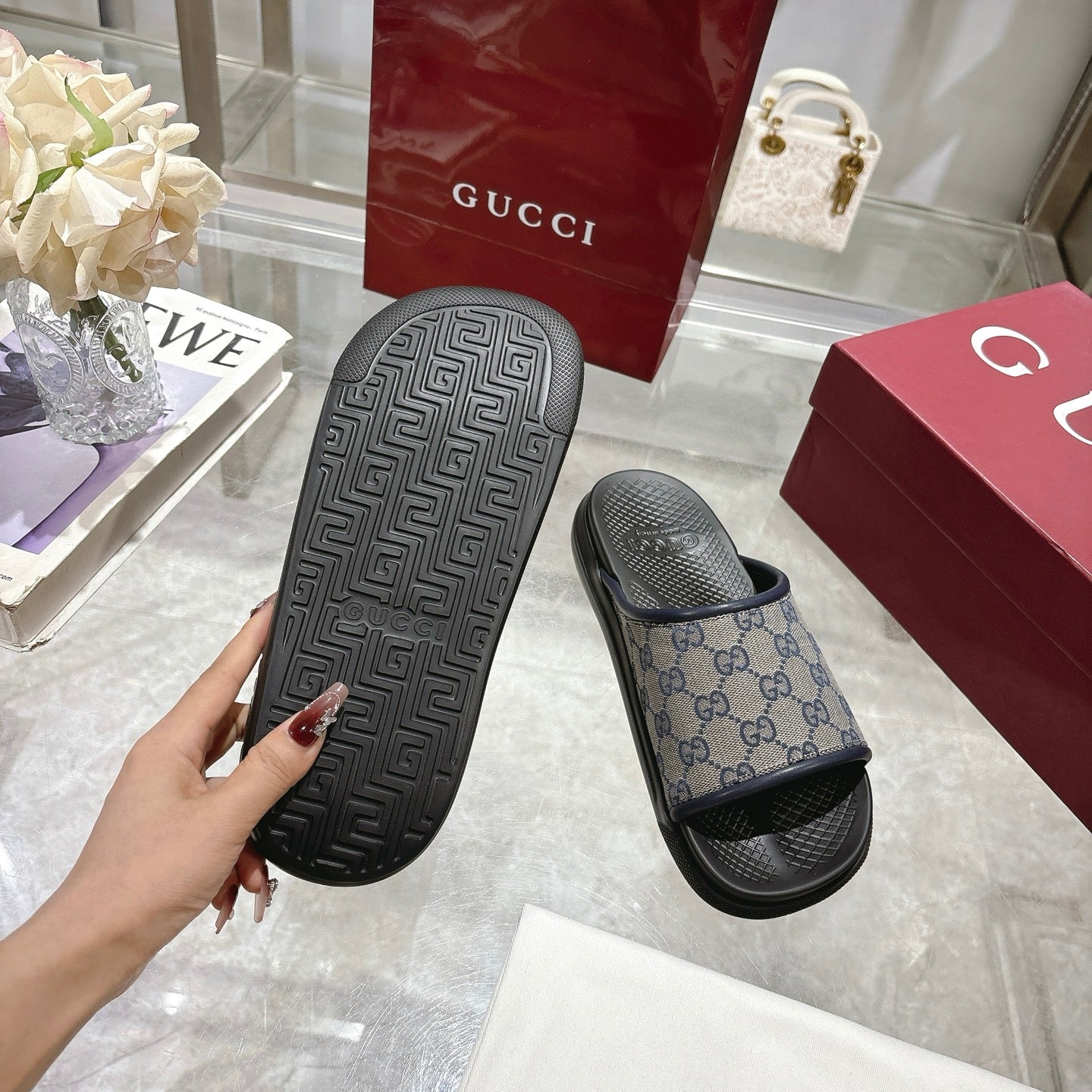 Gucci slide sandals outsole and strap, black tread sole with GG monogram upper