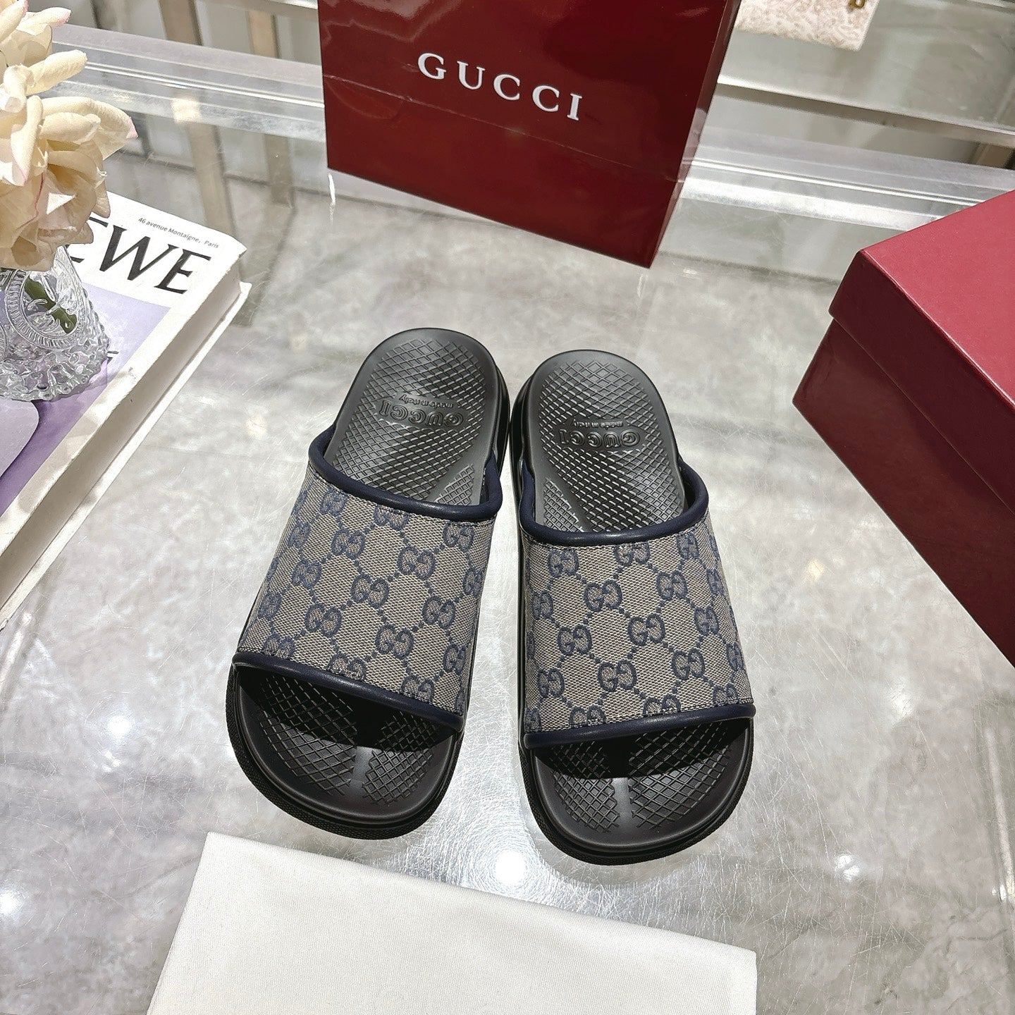 Gucci slide sandals, pair view, GG monogram straps with black rubber soles