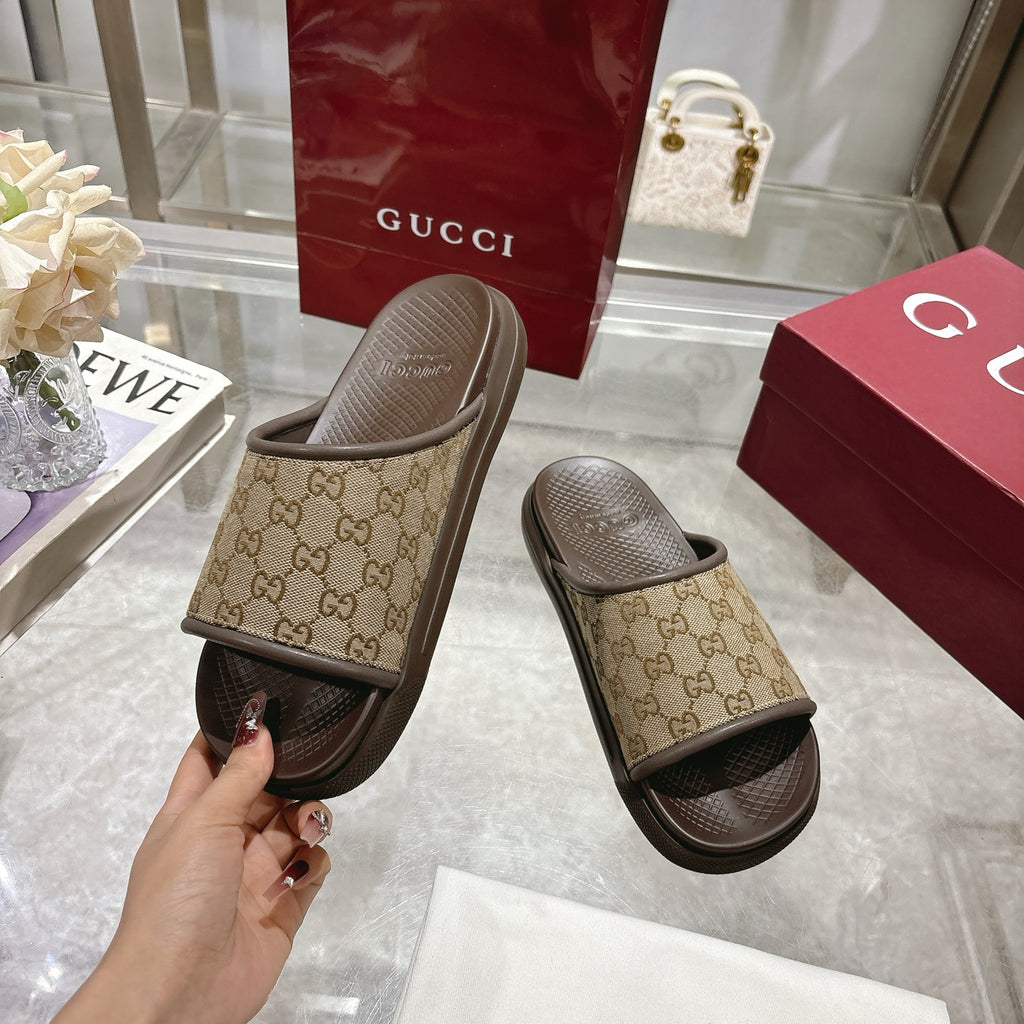 Gucci GG slide sandals held up, tan monogram strap and dark sole