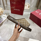 Gucci GG slide sandal side view, tan monogram band with dark sole