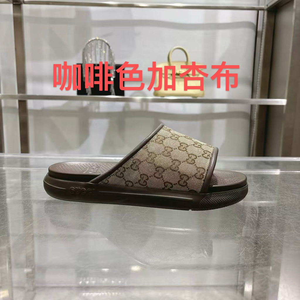 Gucci GG slide sandals with open toe, tan canvas and dark rubber sole