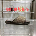 Gucci GG slide sandals with open toe, tan canvas and dark rubber sole