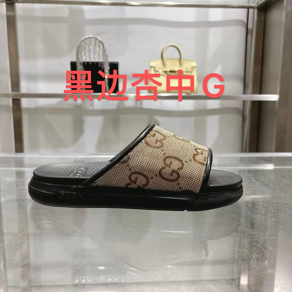 Gucci slide sandals with tan GG canvas straps and black rubber sole