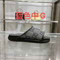 Gucci slide sandals, GG monogram canvas with black rubber strap, blue and cream.