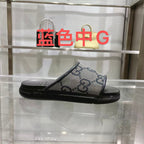 Gucci slide sandals, GG monogram canvas with black rubber strap, blue and cream.