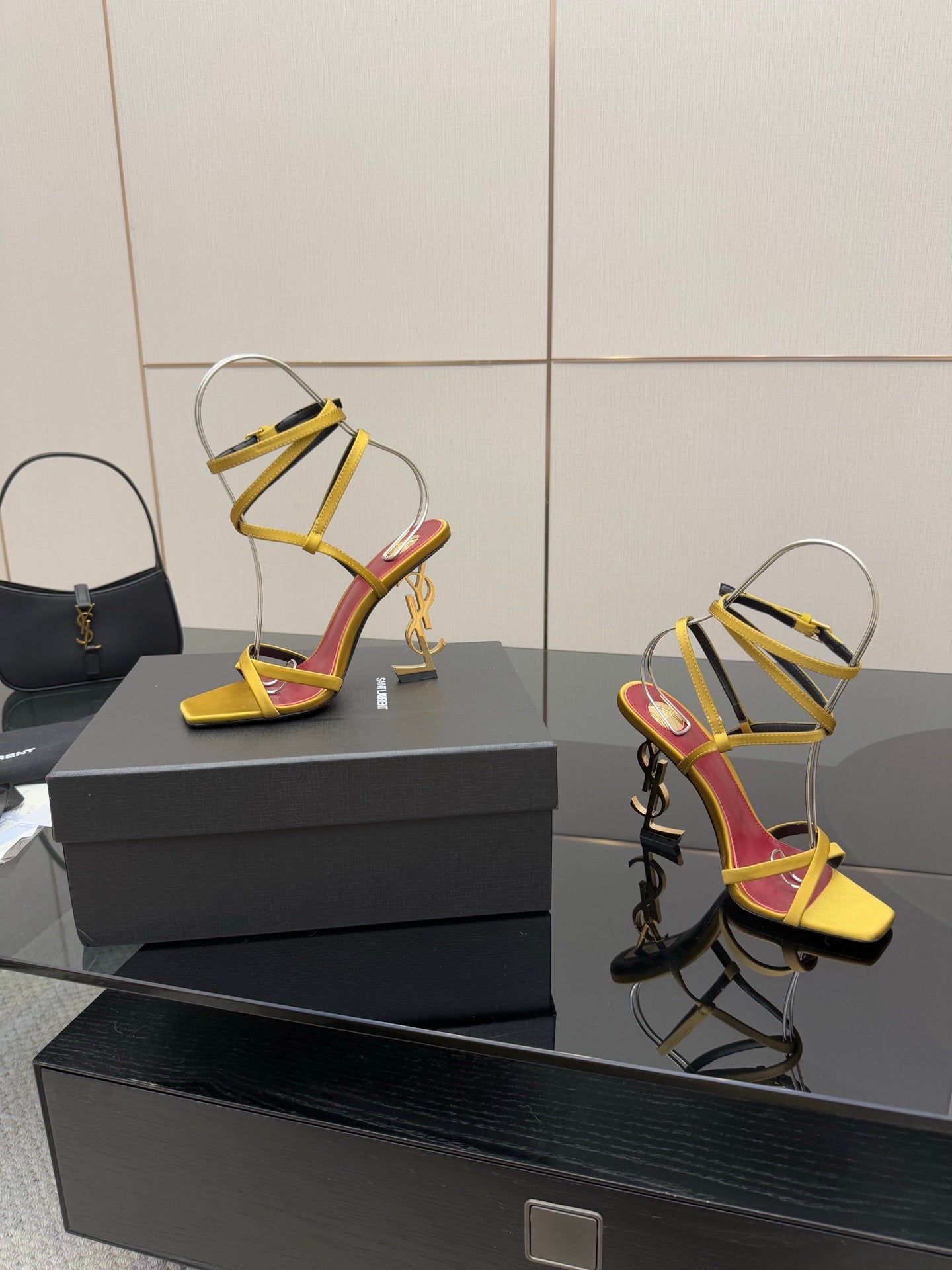 YSL ladies high-heel sandals shown from side, yellow straps and magenta lining