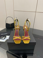 YSL heeled sandals, yellow ankle straps and red lining, open toe, gold charm detail