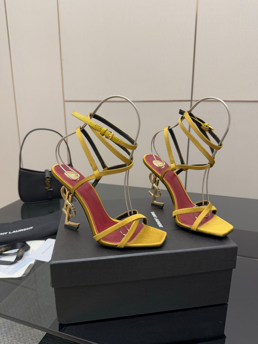 YSL heeled sandals pair, yellow and red straps, gold-tone hardware, open toe