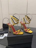 YSL heeled sandals pair, yellow and red straps, gold-tone hardware, open toe