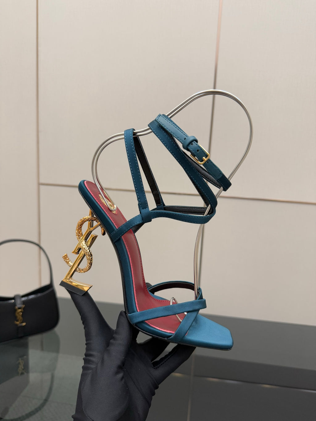 YSL ladies’ strappy heeled sandal, blue ankle straps with red insets and gold charm