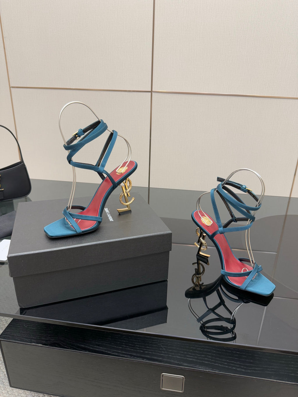 YSL ladies’ strappy heeled sandals with blue straps and red lining, gold hardware visible