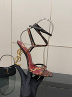 Side view of leopard print strappy high-heel sandal with gold logo heel detail