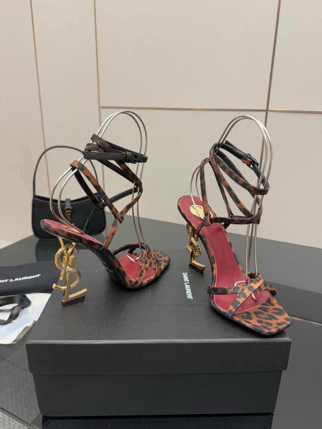 Red and leopard print strappy high-heel sandals with gold logo heel hardware