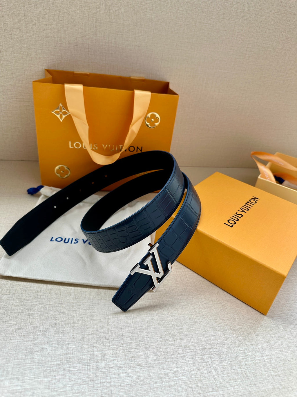 Blue embossed leather belt with LV buckle and leather strap ends